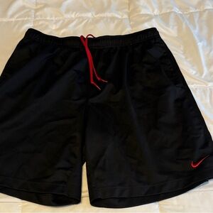 Nike Black Athletic Shorts with Red Drawstring and Logo